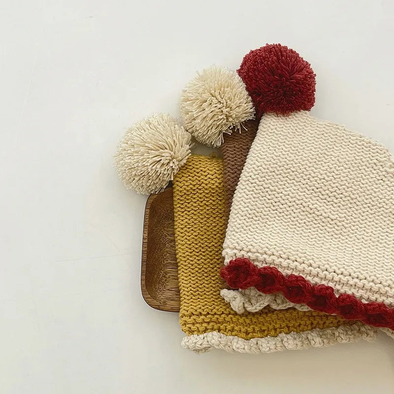 Crochet pixie hat with pom and contrast trim