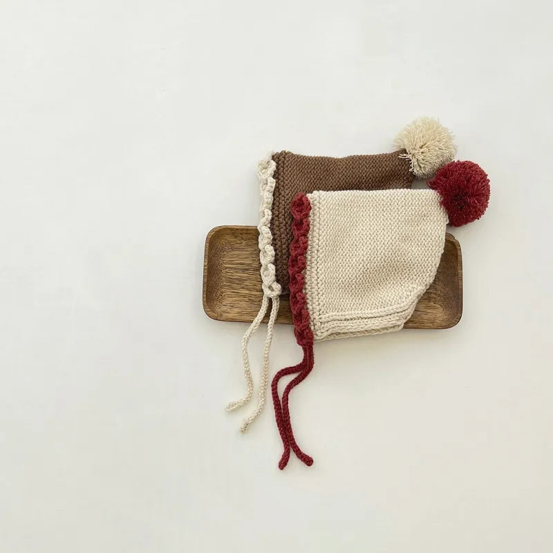 Crochet pixie hat with pom and contrast trim