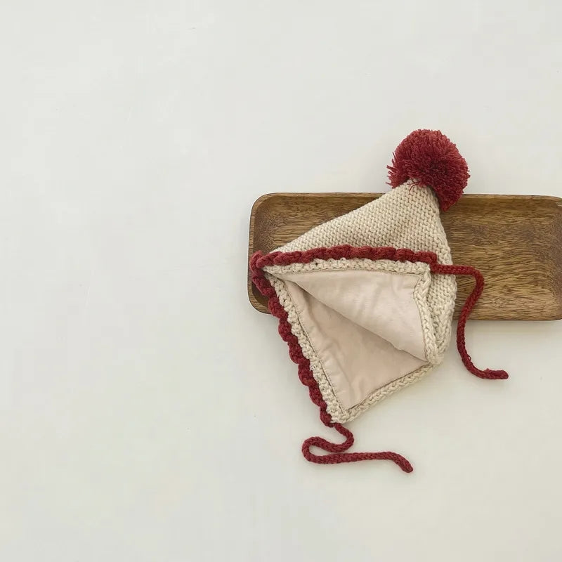 Crochet pixie hat with pom and contrast trim