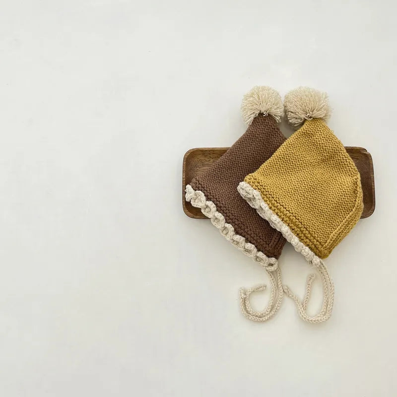 Crochet pixie hat with pom and contrast trim