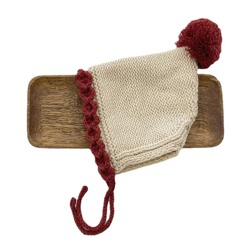 Crochet pixie hat with pom and contrast trim