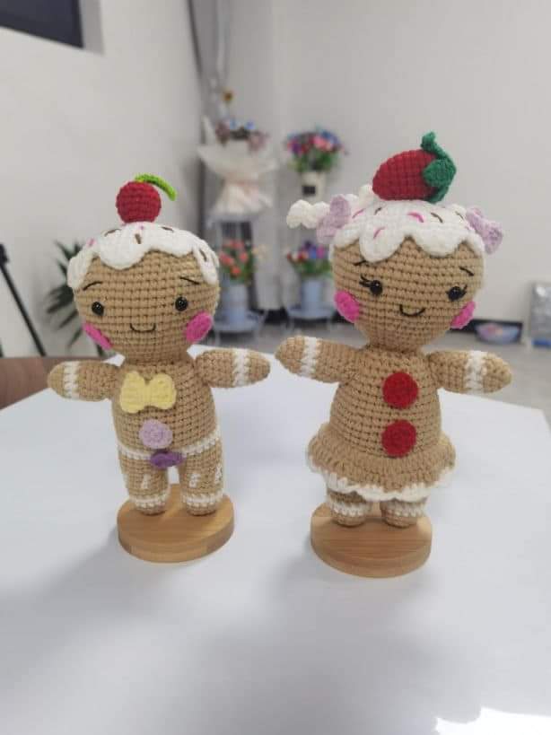 Gingerbread boy and girl crochet dolls