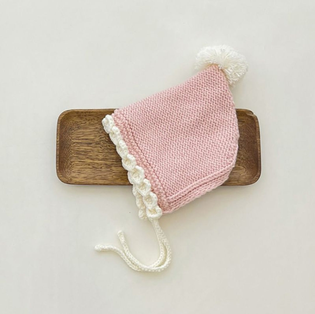 Crochet pixie hat with pom and contrast trim
