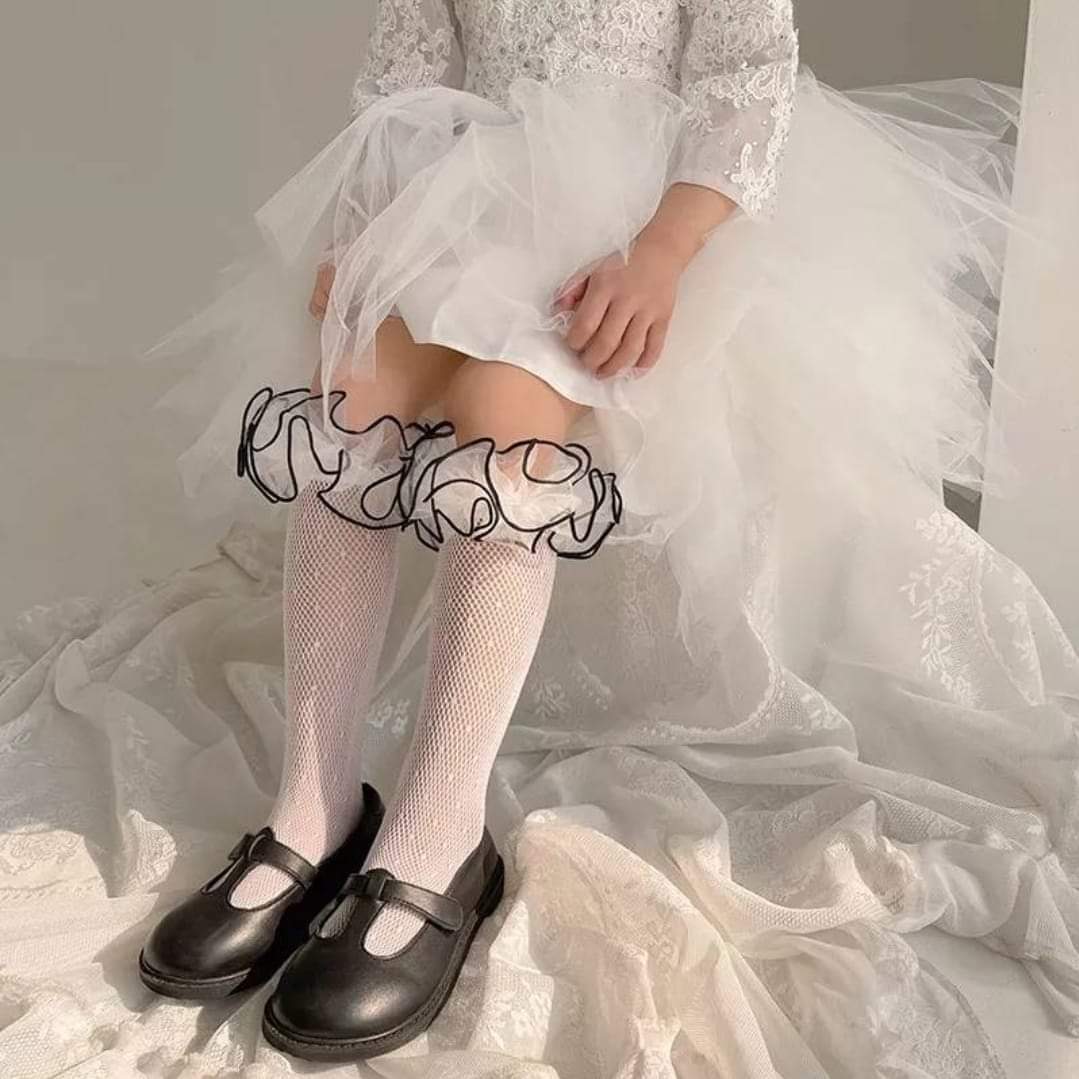 White lace with black ruffle edge